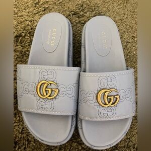 inspired platform slip ons with blue embroidery letter detail